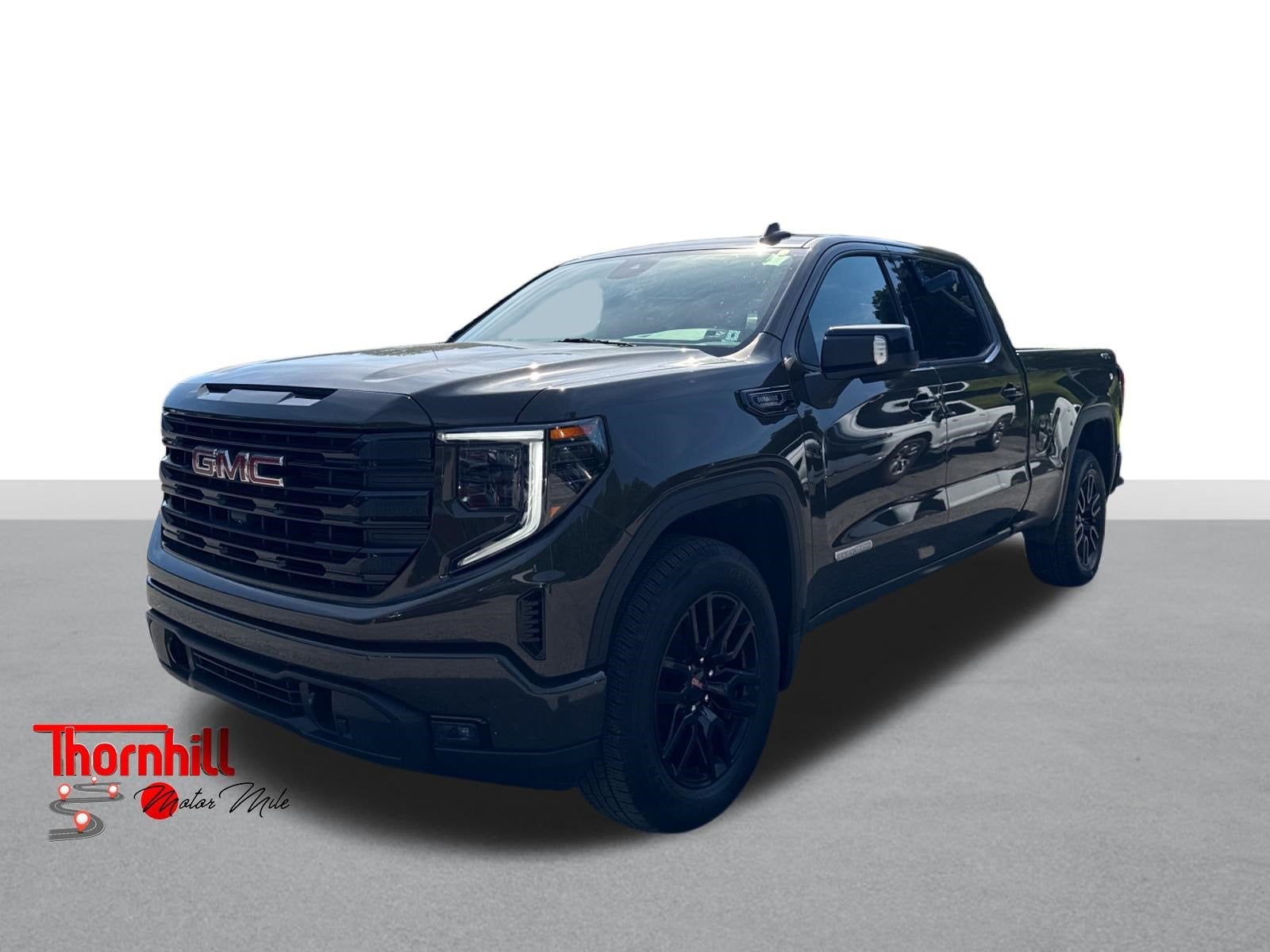 2023 GMC Sierra 1500 Elevation in Deep Bronze Metallic — front three-quarter view
